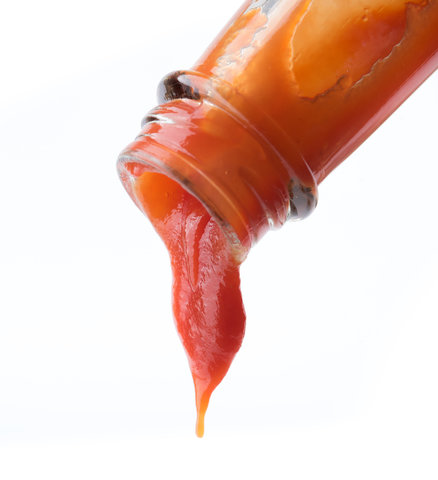 Image of ketchup slowly coming out of bottle, an example of a non-Newtonian fluid.